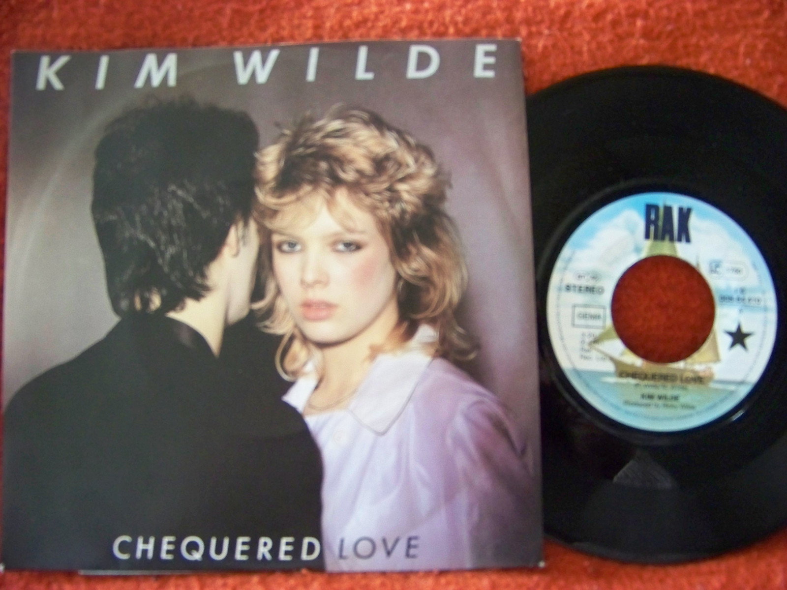 Kim Wilde – Chequered Love / Shane | RAK / EMI Records, 7″ Single