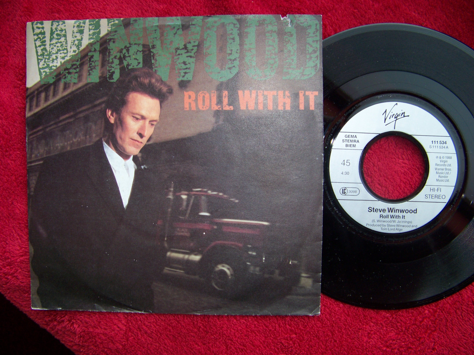 Steve Winwood – Roll with it / The morning side | Virgin Records 111 534 (1988)