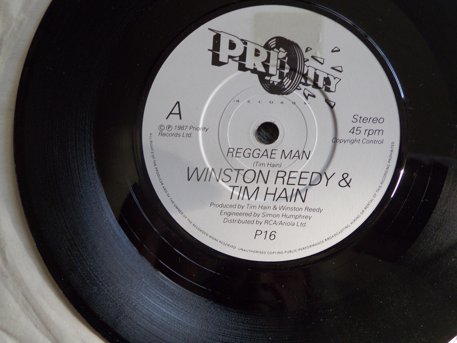 Winston Reedy & Tim Hain – Reggae man / Every day I write the book (Priority Records, P 16, 1987)